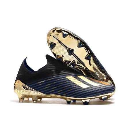 black and gold metal cleats